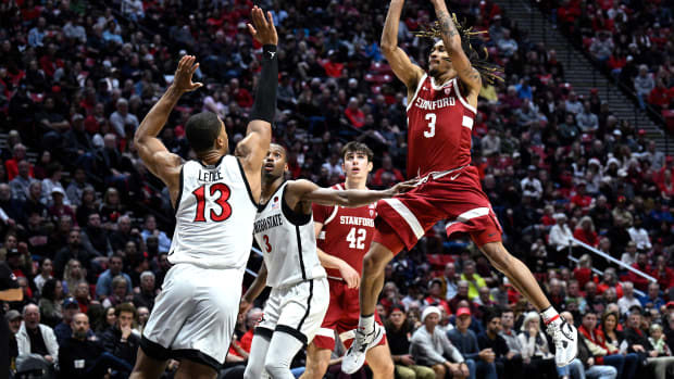 Dec 21, 2023; San Diego, California, USA; Stanford Cardinal guard Kanaan Carlyle (3) shoots the ball over San Diego State Aztecs forward Jaedon LeDee (13) during the second half at Viejas Arena. Mandatory Credit: Orlando Ramirez-USA TODAY Sports